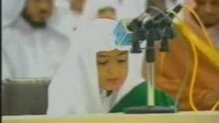 A young brother recites part of Surah al-Ambiya.