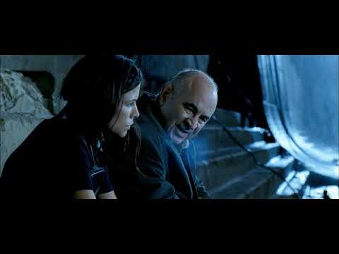 Doomsday (2008) trailer frame: Eden Sinclair scanning a derelict Glasgow street, setting the film’s brutal, post-punk tone