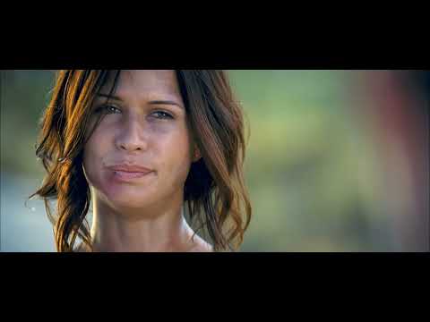 Doomsday trailer frame: the armored convoy rolling toward the wall, score-heavy militaristic build