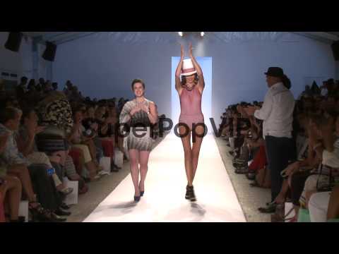 Designer Caitlin Kelly  and model walk the runway during ...