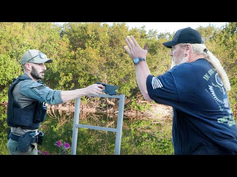 He has hand grenades and a .....