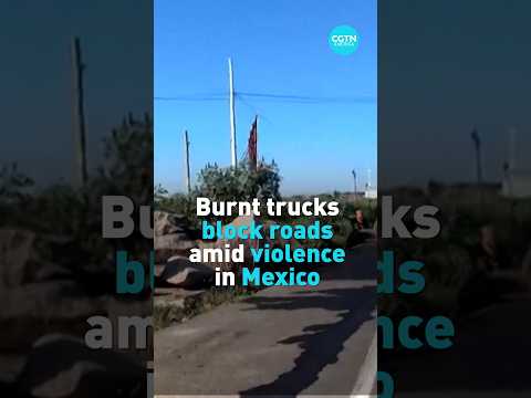 Burnt trucks block roads amid violence in Mexico