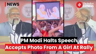 PM Modi Interrupts Karnataka Speech To Acknowledge Girl With Photograph, Promises Personal Letter