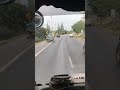 Truck's Loose Wheel Rolls Along Road