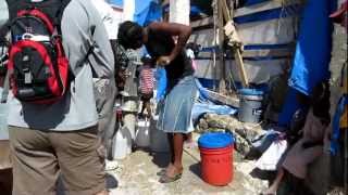 preview picture of video 'Haitian Woman Pumping Water from a Living Water International Well'