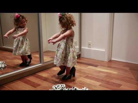 Little Girl Dances in Front of Mirror