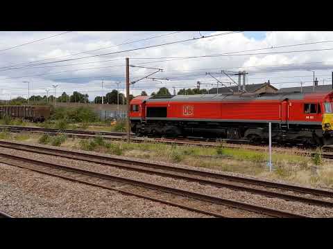 DB CARGO 66017 light locomotive passes through peterborough station on 3/8/23