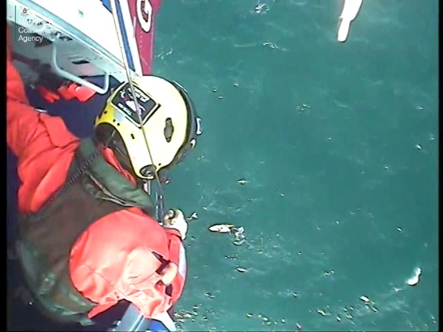 Dramatic moment surfer is plucked from the water after 30 hours at sea