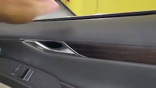 2023 Genesis G80 bottom sweep removal for Tinting the Windows in The Villages, FL by Tint Man FL