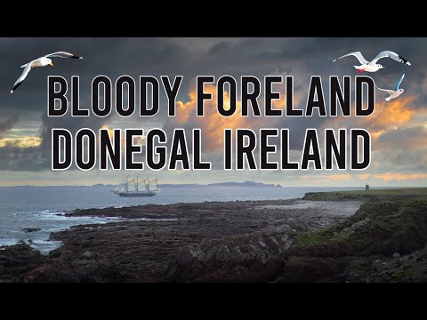 Bloody foreland Sea Arch and a view of Tory Island