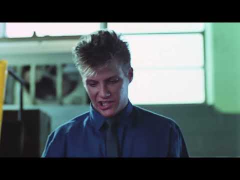 Trick or Treat 1986 official trailer frame: Eddie Weinbauer alone with a blaring stereo and lightning-lit bedroom
