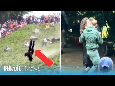 Moment man somersaults down cheese-rolling hill