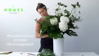 How to arrange flowers in a tall vase