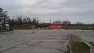 preview picture of video '20140426 194328 Orange Helicopter Landing At Hospital'