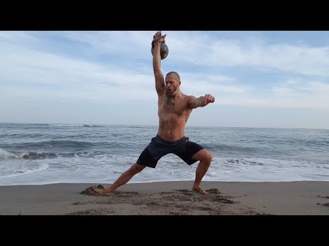 Single-arm overhead kettlebell cossack squat