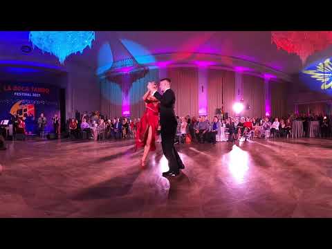  Viktoria Krivcova  and  Dmitriy Rizhov  are  dancing  to  the  tango  "  Loca  "  by  Solo Tango Orquesta  at  La Boca Tango Festival  in  2021