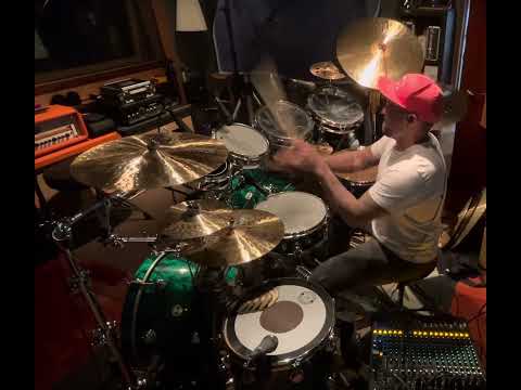 Tony Escapa working out parts in the studio.
