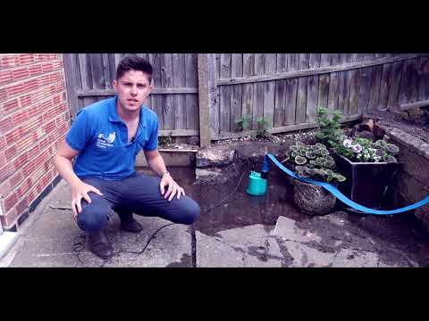 How to Drain a Flooded Patio Using a Water Pump
