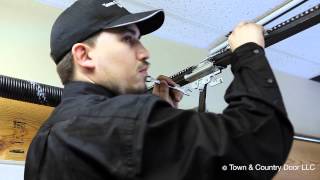 How to Adjust the Chain Tension of Garage Door Opener | Town & Country Door LLC