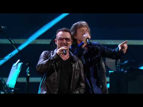 U2 and Mick Jagger perform "Stuck in a Moment You Can't Get Out Of" at the 25th Anniversary concert.