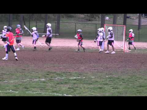 Bethesda Lacrosse U13 defenseman scoring a goal