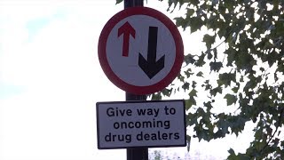 E2 Drug Problem Highlighted With Dealer Traffic Signs and Parking Spaces