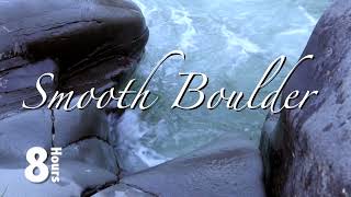 Watch and listen to the water swirl around next to the smooth boulders on the edge of the river.