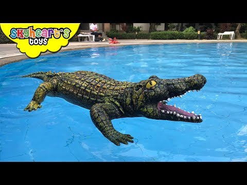 GIANT CROCODILE in our swimming pool! Skyheart orca whale pool battle with alligator sharks toys