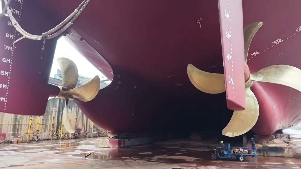 Fascinating scale of a super huge cargo ship on a dry dock