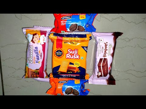 Lots of cakes & biscuits| Bauli sandwich choco vanilla cake w/ choco sprinkles & orange vanilla cake