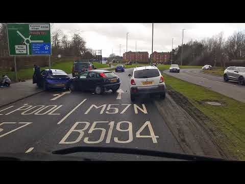 Aftermath of a crash involving 2 cars and a cyclist who received  Minor injuries A57 M57 Prescott.