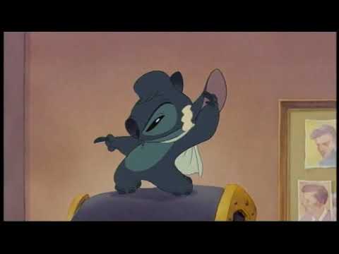 Lilo & Stitch 2: Stitch Has a Glitch trailer frame showing Lilo, Stitch, and a sunset over Kauaʻi