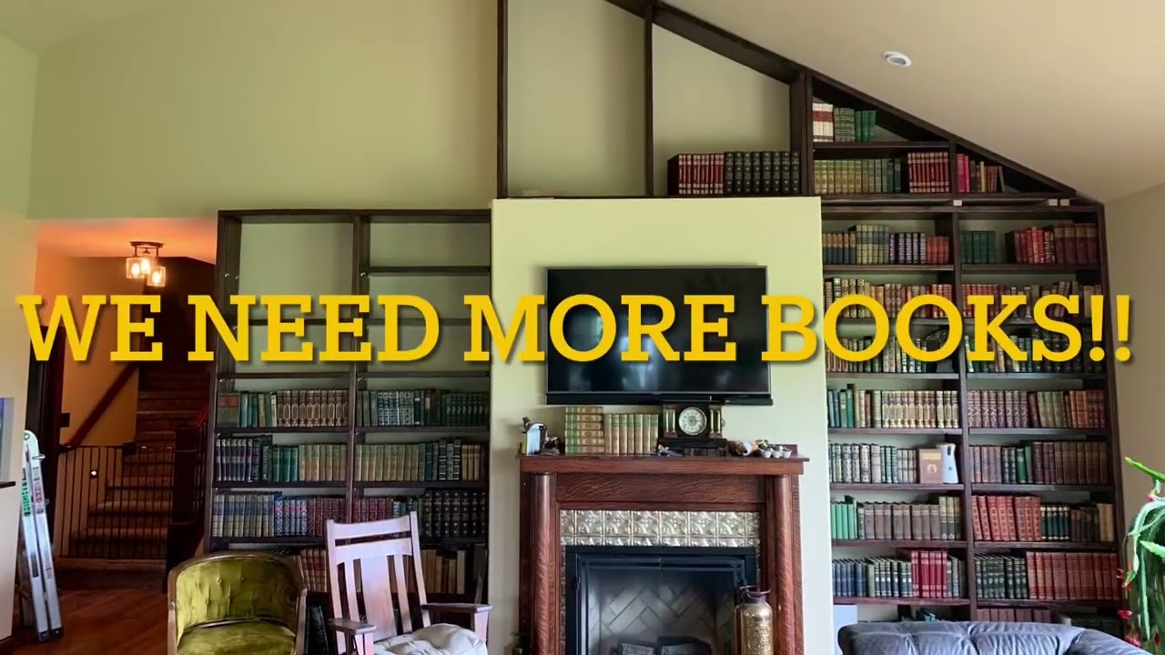 DIY library book shelf build. Private book collection. Massive wall of books.