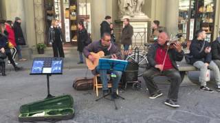 Musicians playing I Love Paris / I Love Las Vegas outside the Duomo in Florence