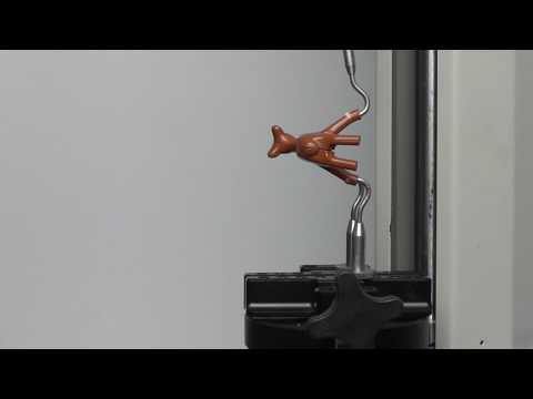 Safety testing plastic toy figures.   Mecmesin Force & Torque Measurement Systems