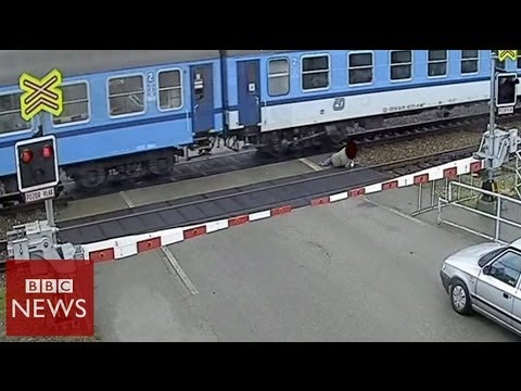CCTV: Czech man nearly hit by train - BBC News
