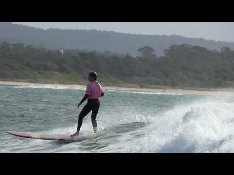 Shadie surfs Arrawarra Headland