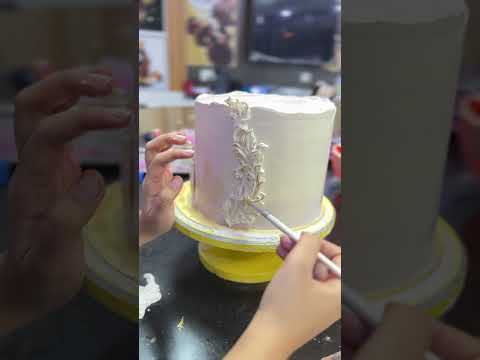 “Creating this dreamy three-tier cake was pure magic!💕 #CakeArt #BakingLove #LilacWhiteGold