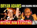 "Epic Guitar Battle: Bryan Adams & His Guitarist Rock 'Kids Wanna Rock' Live!"