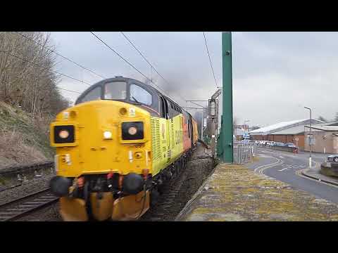 Colas 37099 and 37175 thunder out of Carlisle heading north