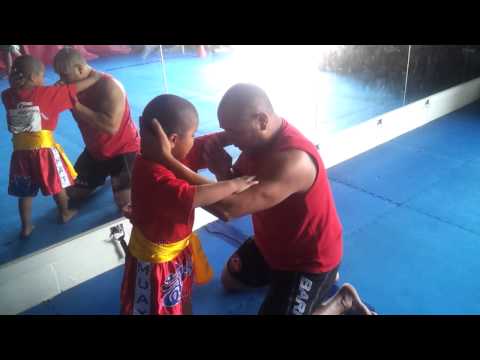 Six year old Andreas learning the Thai clinch