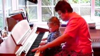 Ethan and Nessie play keyboard