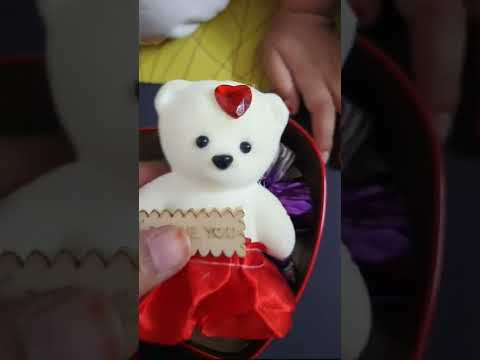 Unboxing red heart shaped chocolate and teddy gift box