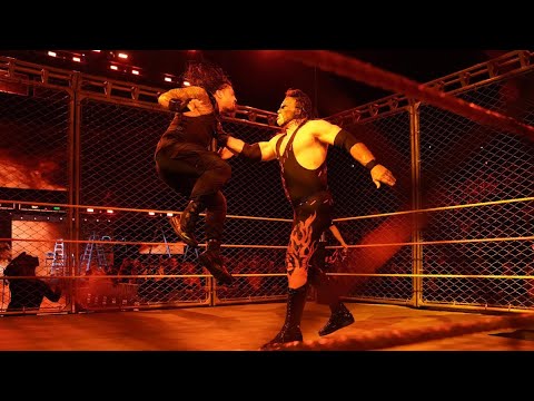 Kane returns during a Cage Match between Roman Reigns and Braun Strowman: Raw, Oct. 16, 2017