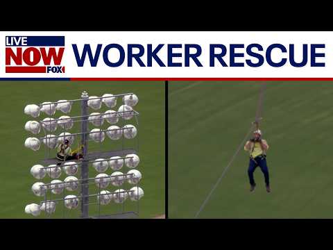 Video | Video: Worker rescued from light pole at baseball stadium