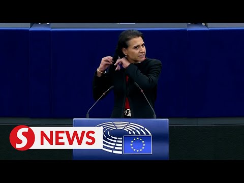 Swedish lawmaker cuts hair at podium during EU debate on Iran protests