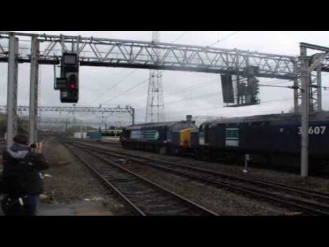 DRS 37607 & 37608 depart Crewe Sidings.