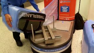 Suitcase Wrapped In Plastic At JetBlue Terminal JFK Airport