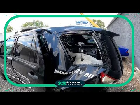 Distracted driver hits police officer's SUV while he's inside