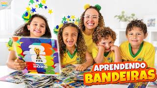 ABRIMOS FIGURINHAS DA COPA 2026 E APRENDEMOS OS PAÍSES PELAS BANDEIRAS - FAMÍLIA BELLA E LUCCA SHOW